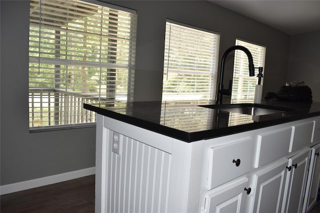 25 Wood Gln, Trinity, TX 75862 - kitchen with dark countertops, plenty of natural light, and dark wood-type flooring