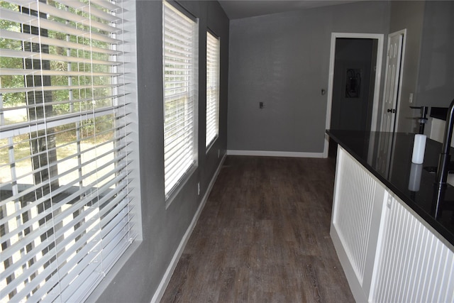 25 Wood Gln, Trinity, TX 75862 - corridor featuring dark wood-style floors and baseboards