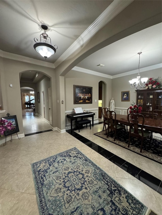 17907 Camp Cove Dr, Cypress, TX 77429 - dining area featuring arched walkways, tile patterned flooring, crown molding, and a chandelier