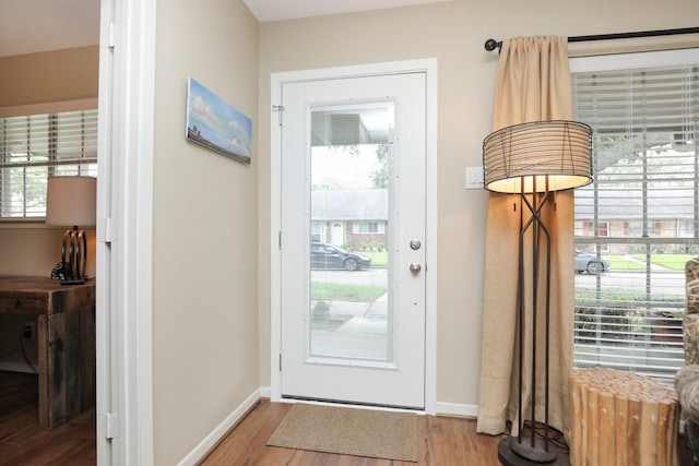 1015 Tri Oaks Ln Unit 23, Houston, TX 77043 - doorway to outside with wood finished floors and healthy amount of natural light