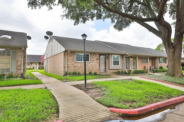 1015 Tri Oaks Ln Unit 23, Houston, TX 77043 - single story home featuring brick siding and board and batten siding