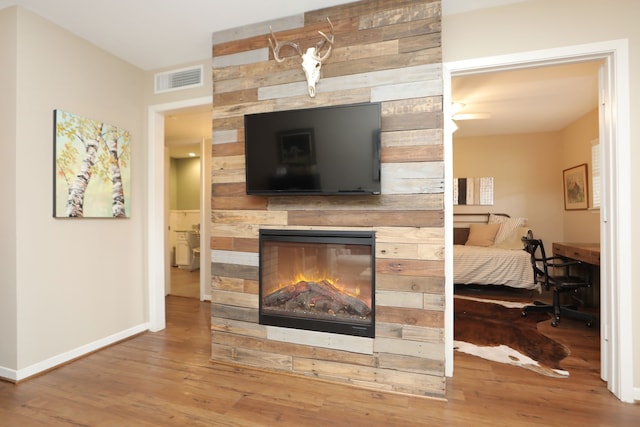 1015 Tri Oaks Ln Unit 23, Houston, TX 77043 - living area with wood finished floors and a fireplace