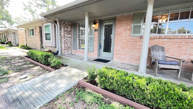 1015 Tri Oaks Ln Unit 23, Houston, TX 77043 - entrance to property featuring brick siding and a porch