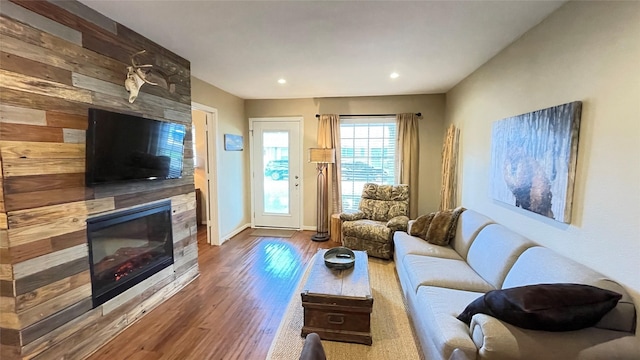 1015 Tri Oaks Ln Unit 23, Houston, TX 77043 - living room featuring a fireplace, wood finished floors, and recessed lighting