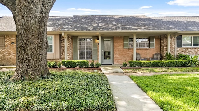 1015 Tri Oaks Ln Unit 23, Houston, TX 77043 - view of front of property featuring brick siding and a shingled roof