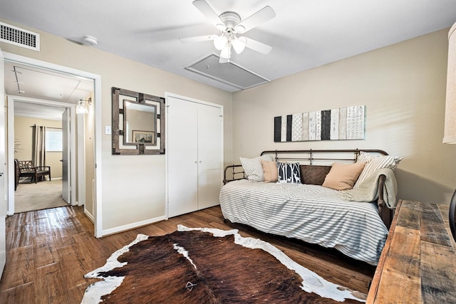 1015 Tri Oaks Ln Unit 23, Houston, TX 77043 - bedroom with attic access, wood finished floors, ceiling fan, and a closet