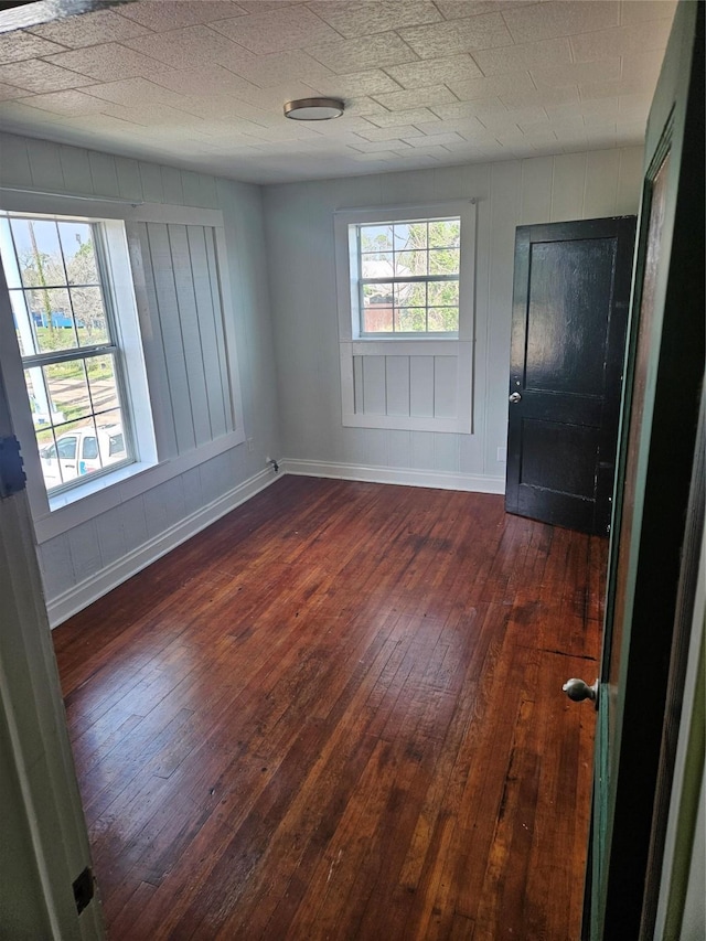 208 W 2nd St, Sweeny, TX 77480 - spare room with dark wood-style floors and baseboards