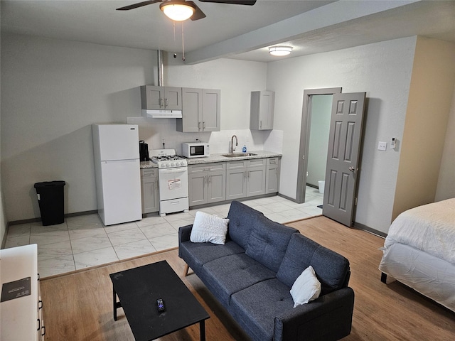 208 W 2nd St, Sweeny, TX 77480 - bedroom with freestanding refrigerator and a sink