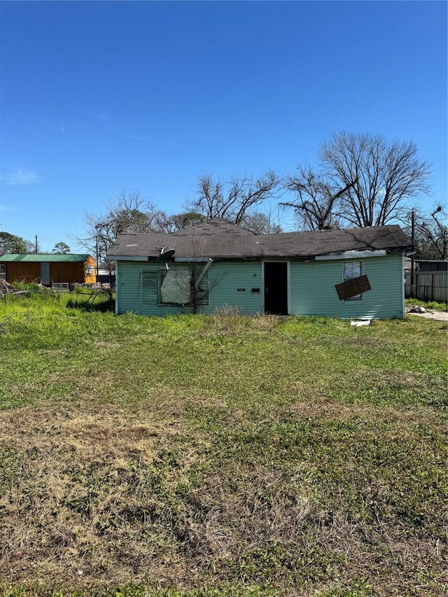 8716 Allwood St, Houston, TX 77016 - back of property featuring a lawn
