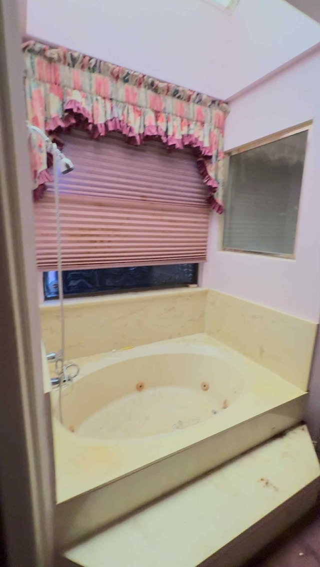 2302 Ashford Hollow Ln, Houston, TX 77077 - bathroom featuring a jetted tub