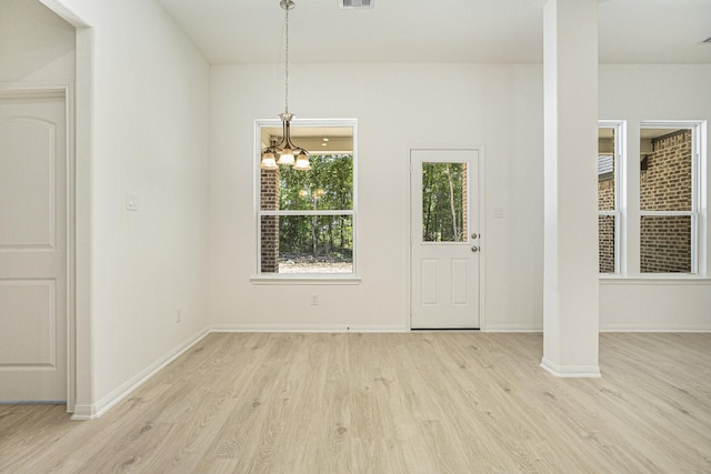 11775 Oakwood Rnch, Willis, TX 77378 - foyer entrance with light wood-style flooring and a chandelier
