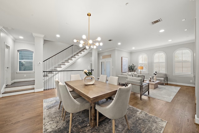 1829 W Main St Unit C, Houston, TX 77098 - dining space featuring recessed lighting, stairway, light wood-style floors, ornamental molding, and a chandelier