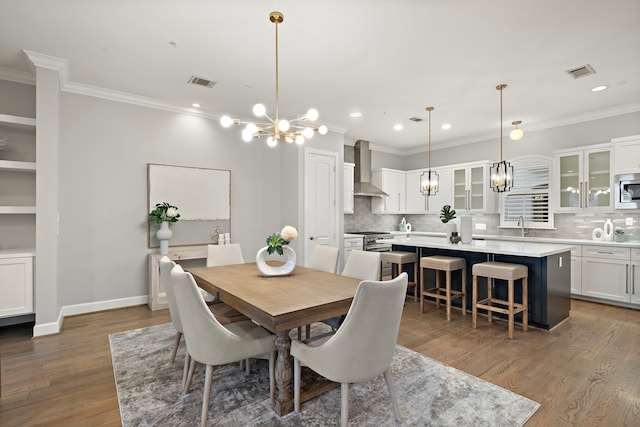 1829 W Main St Unit C, Houston, TX 77098 - dining space featuring a chandelier, recessed lighting, wood finished floors, and ornamental molding