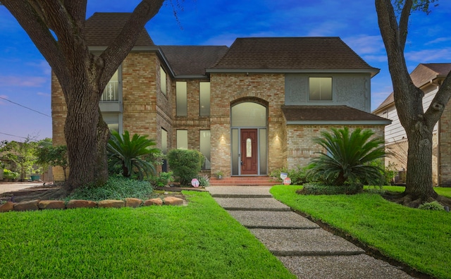 3318 Teawick Ct, Houston, TX 77068 - tudor house featuring brick siding, a front lawn, and a shingled roof