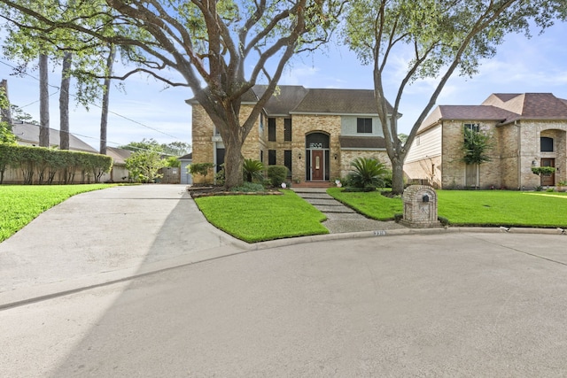 3318 Teawick Ct, Houston, TX 77068 - view of front of house with a front yard, brick siding, and stone siding