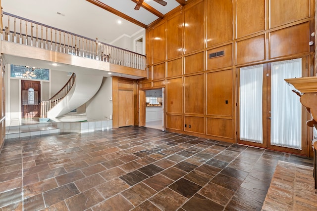 3318 Teawick Ct, Houston, TX 77068 - unfurnished living room featuring a towering ceiling, stone tile flooring, and stairway