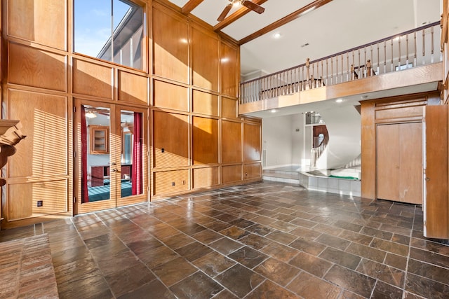 3318 Teawick Ct, Houston, TX 77068 - unfurnished living room featuring a ceiling fan, a towering ceiling, and stone tile flooring