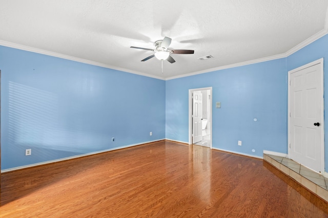 3318 Teawick Ct, Houston, TX 77068 - spare room featuring wood finished floors, a ceiling fan, ornamental molding, and a textured ceiling