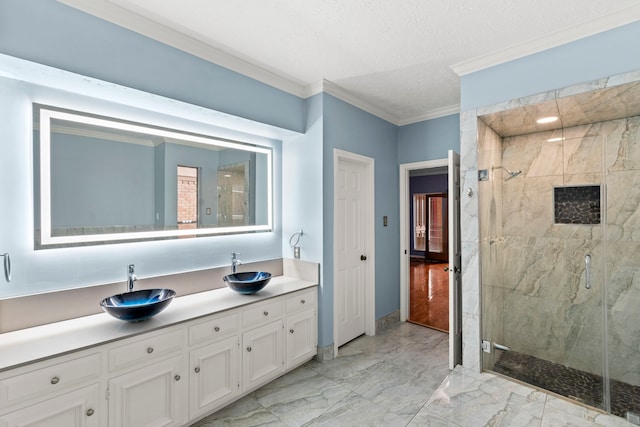3318 Teawick Ct, Houston, TX 77068 - bathroom with marble finish flooring, ornamental molding, a marble finish shower, vanity, and a textured ceiling