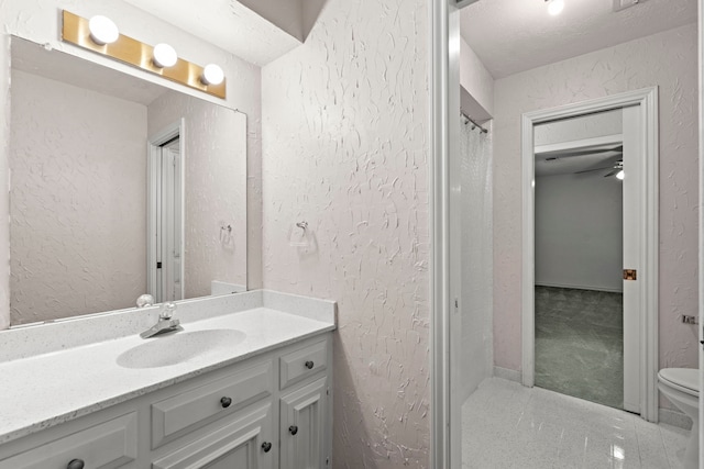 3318 Teawick Ct, Houston, TX 77068 - bathroom featuring vanity, a textured wall, and tile patterned flooring