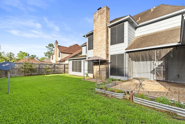 3318 Teawick Ct, Houston, TX 77068 - rear view of house featuring a chimney, a fenced backyard, a patio area, and roof with shingles