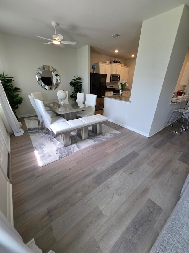 11407 Prairie Walk Dr, Houston, TX 77048 - dining space with wood finished floors, recessed lighting, and ceiling fan