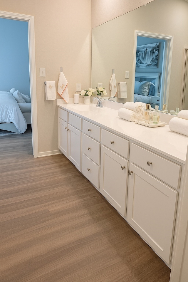 11407 Prairie Walk Dr, Houston, TX 77048 - bathroom featuring ensuite bathroom, vanity, and wood finished floors
