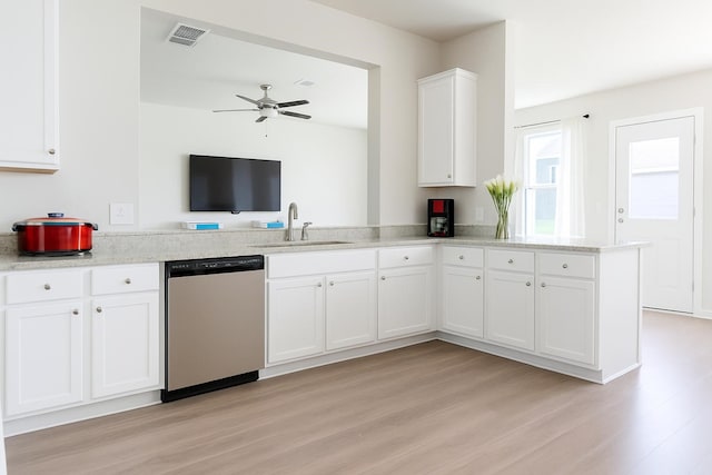 11407 Prairie Walk Dr, Houston, TX 77048 - kitchen featuring stainless steel dishwasher, a peninsula, light wood-type flooring, and white cabinetry