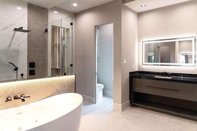 7302 Schiller St, Houston, TX 77055 - full bathroom with a freestanding tub, vanity, a walk in shower, recessed lighting, and tile patterned floors
