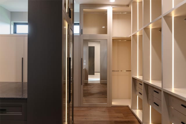 7302 Schiller St, Houston, TX 77055 - walk in closet featuring wood finished floors