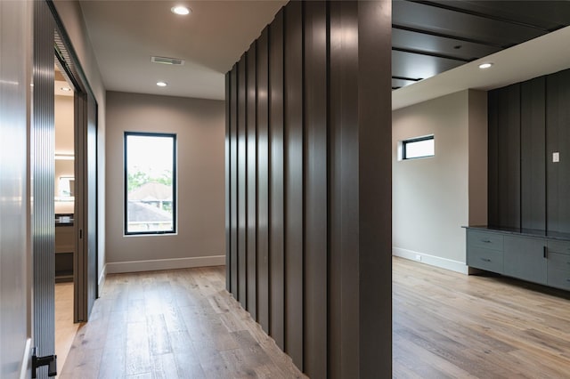 7302 Schiller St, Houston, TX 77055 - corridor featuring light wood-type flooring, healthy amount of natural light, and recessed lighting