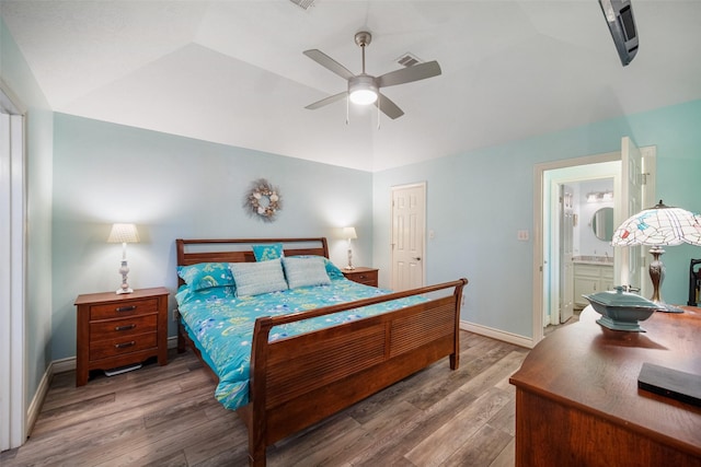 17383 Harbor Dr, Montgomery, TX 77356 - bedroom with vaulted ceiling, wood finished floors, a ceiling fan, and ensuite bath