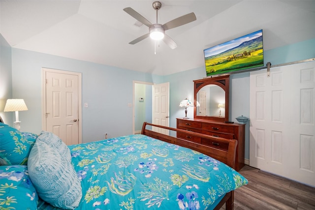 17383 Harbor Dr, Montgomery, TX 77356 - bedroom with wood finished floors, a ceiling fan, vaulted ceiling, and a barn door