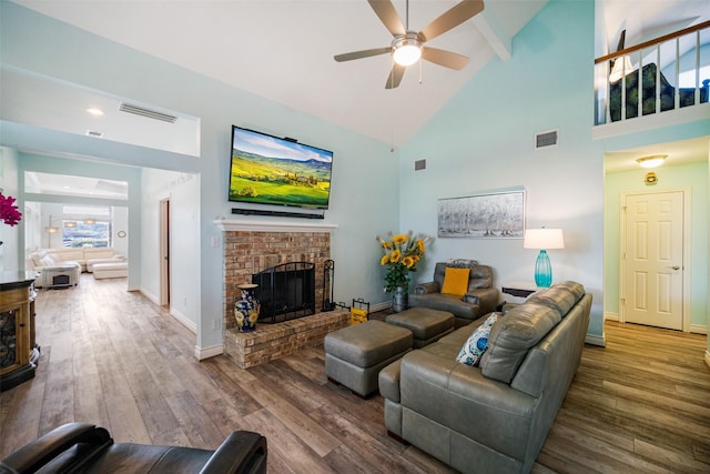17383 Harbor Dr, Montgomery, TX 77356 - living room with a ceiling fan, wood finished floors, high vaulted ceiling, a brick fireplace, and beam ceiling