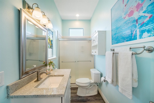 17383 Harbor Dr, Montgomery, TX 77356 - bathroom with wood finished floors, vanity, and a shower stall