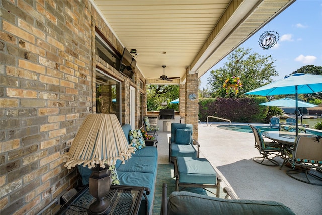 17383 Harbor Dr, Montgomery, TX 77356 - view of patio / terrace featuring a ceiling fan, outdoor dining space, an outdoor living space, and an outdoor kitchen