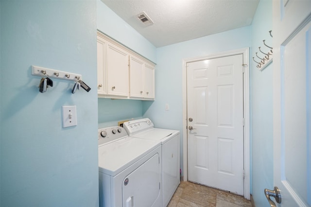 17383 Harbor Dr, Montgomery, TX 77356 - washroom featuring cabinet space, independent washer and dryer, and a textured ceiling