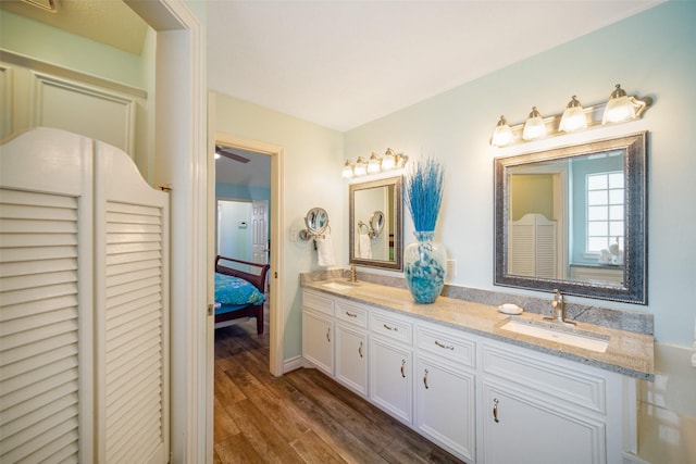 17383 Harbor Dr, Montgomery, TX 77356 - ensuite bathroom with double vanity, wood finished floors, and a ceiling fan