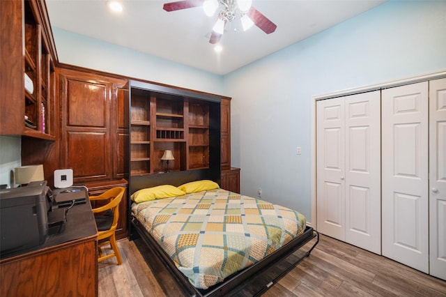 17383 Harbor Dr, Montgomery, TX 77356 - bedroom featuring a closet, wood finished floors, and a ceiling fan