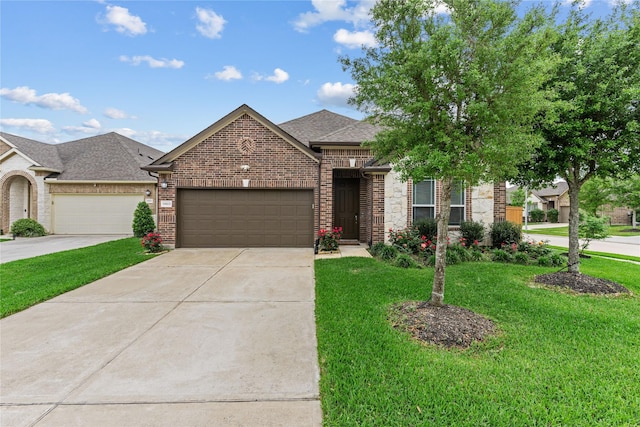 19815 Caprock Falls Ct, Cypress, TX 77433 - view of front of home featuring an attached garage, concrete driveway, a front lawn, a shingled roof, and brick siding