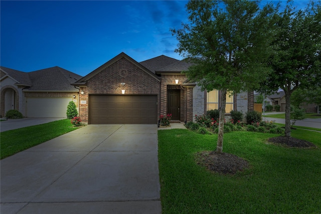 19815 Caprock Falls Ct, Cypress, TX 77433 - view of front facade featuring an attached garage, concrete driveway, a front yard, and brick siding