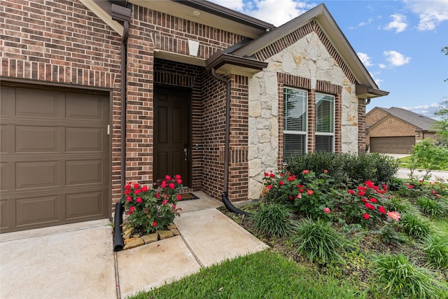 19815 Caprock Falls Ct, Cypress, TX 77433 - doorway to property with an attached garage, brick siding, and stone siding