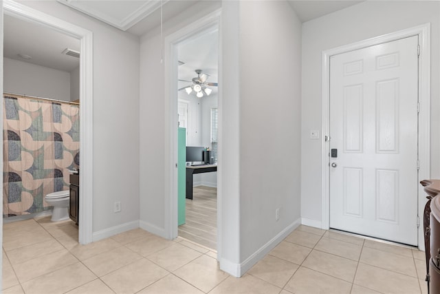 19815 Caprock Falls Ct, Cypress, TX 77433 - foyer with light tile patterned floors and a ceiling fan