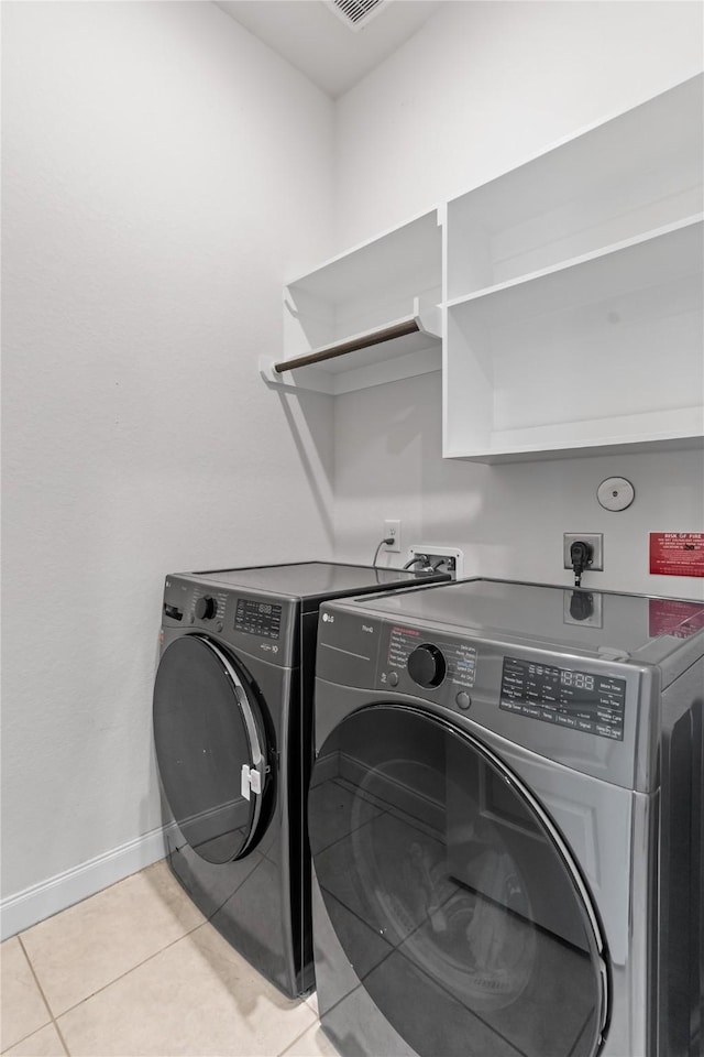 19815 Caprock Falls Ct, Cypress, TX 77433 - washroom with independent washer and dryer and light tile patterned floors