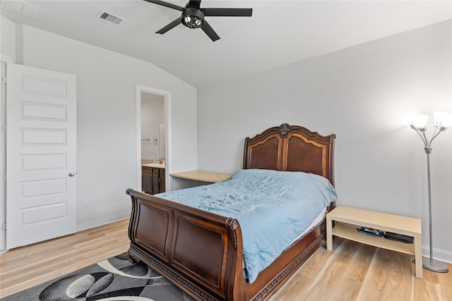 19815 Caprock Falls Ct, Cypress, TX 77433 - bedroom with light wood-style flooring, vaulted ceiling, ensuite bathroom, and ceiling fan