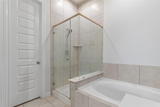 19815 Caprock Falls Ct, Cypress, TX 77433 - bathroom featuring a garden tub, a shower stall, and tile patterned floors