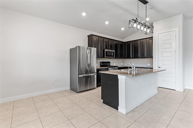 19815 Caprock Falls Ct, Cypress, TX 77433 - kitchen with stainless steel appliances, tasteful backsplash, light stone counters, light tile patterned floors, and lofted ceiling