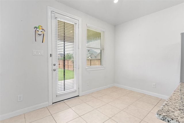 19815 Caprock Falls Ct, Cypress, TX 77433 - doorway to outside with baseboards and light tile patterned floors