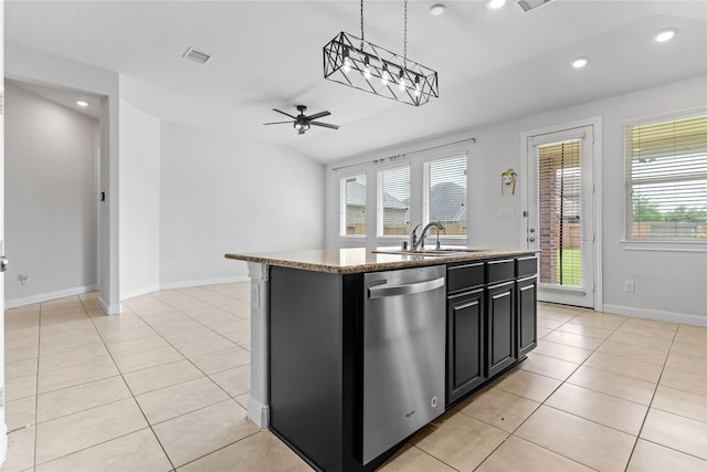 19815 Caprock Falls Ct, Cypress, TX 77433 - kitchen featuring stainless steel dishwasher, a ceiling fan, dark cabinetry, light tile patterned floors, and a kitchen island with sink