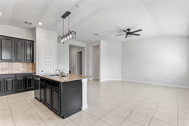 19815 Caprock Falls Ct, Cypress, TX 77433 - kitchen featuring vaulted ceiling, dishwasher, ceiling fan, light tile patterned floors, and backsplash